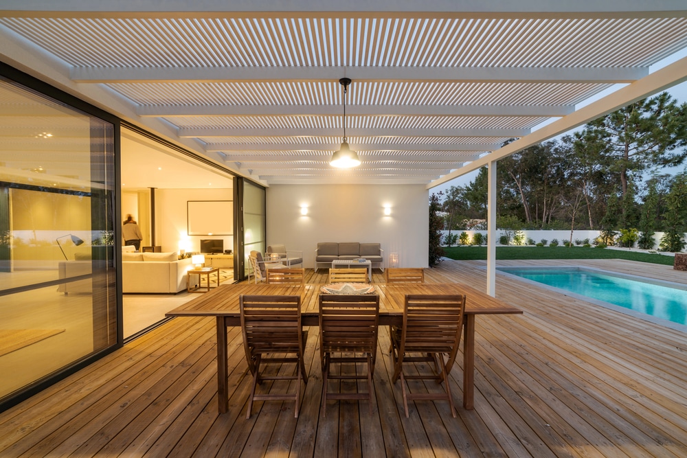 A louvered pergola with lighting
