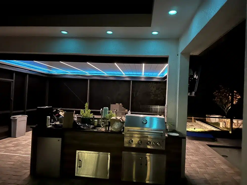 Motorized louvered pergola made by enVision Pergola with LED lighting