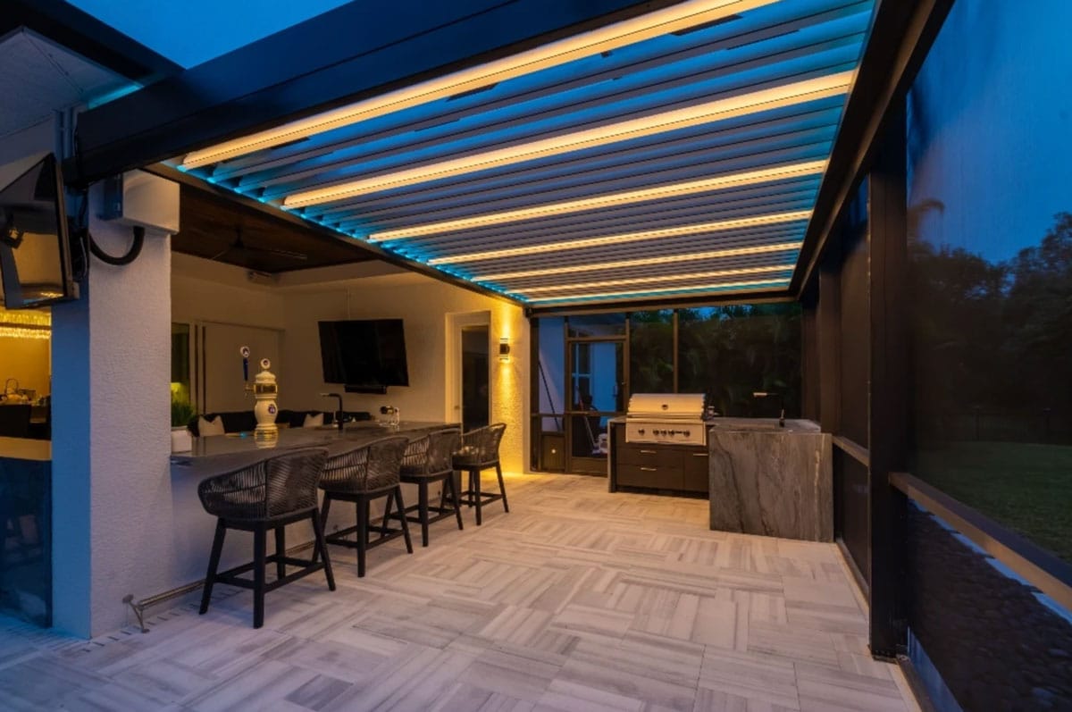 A screened in pergola porch