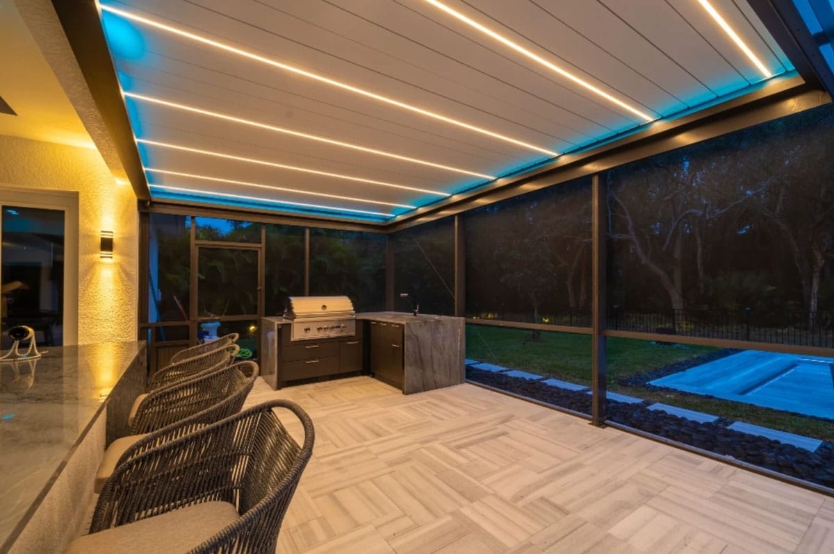 A screened in pergolas in Florida with a BBQ grill