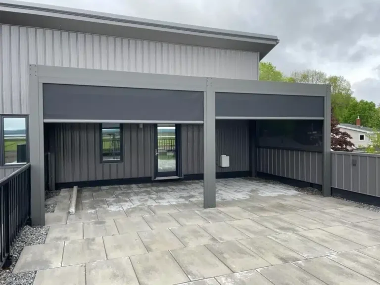 Outdoor pergola with motorized shade screens providing sun and privacy control on patio