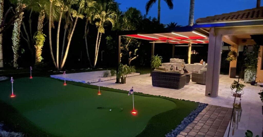 Wind resistant pergola with integrated lighting for nighttime outdoor use