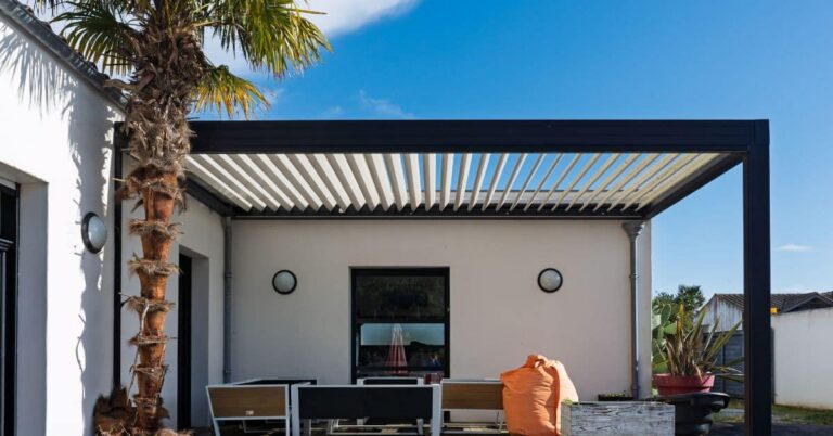 Modern wall mounted pergola with adjustable roof attached to home patio for outdoor shade